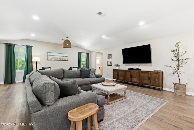 86290 Weldon Ave, Yulee, FL 32097 - living room with lofted ceiling, wood finished floors, healthy amount of natural light, baseboards, and recessed lighting