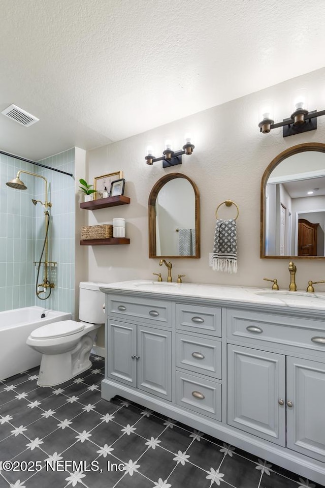 86290 Weldon Ave, Yulee, FL 32097 - full bathroom with double vanity, a textured ceiling, toilet, and washtub / shower combination