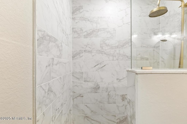 86290 Weldon Ave, Yulee, FL 32097 - bathroom featuring a walk in shower and a textured wall