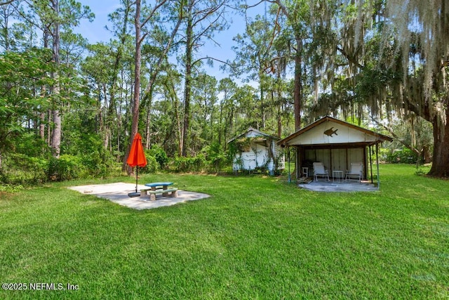 86290 Weldon Ave, Yulee, FL 32097 - view of grassy yard with a patio