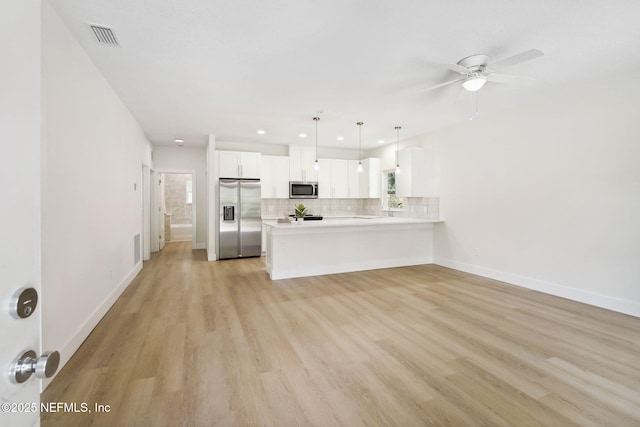 771 W 4th St, Saint Augustine, FL 32084 - unfurnished living room featuring light wood-style flooring, recessed lighting, ceiling fan, baseboards, and plenty of natural light