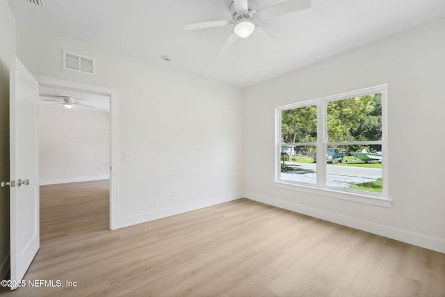 771 W 4th St, Saint Augustine, FL 32084 - empty room featuring a ceiling fan, light wood finished floors, and baseboards