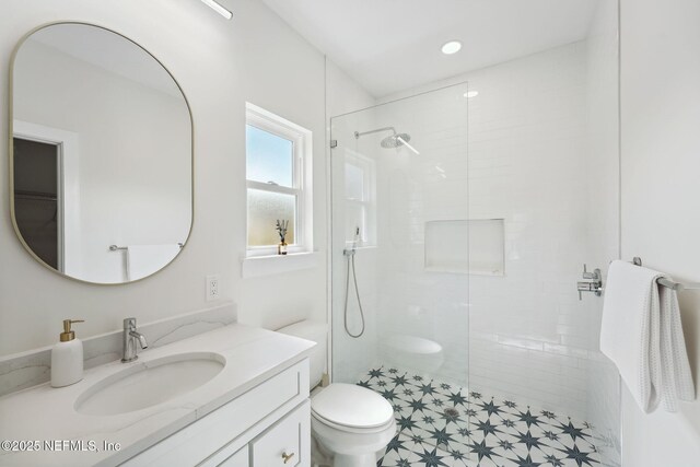 771 W 4th St, Saint Augustine, FL 32084 - bathroom with a walk in shower, vanity, and toilet