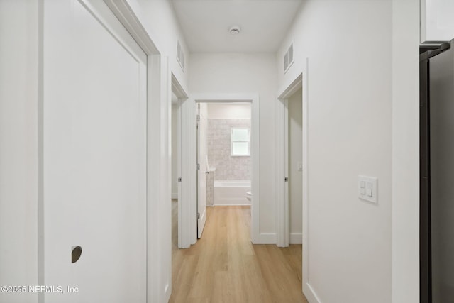 771 W 4th St, Saint Augustine, FL 32084 - hall with light wood-type flooring and baseboards