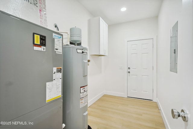 771 W 4th St, Saint Augustine, FL 32084 - utility room with water heater, heating unit, and electric panel