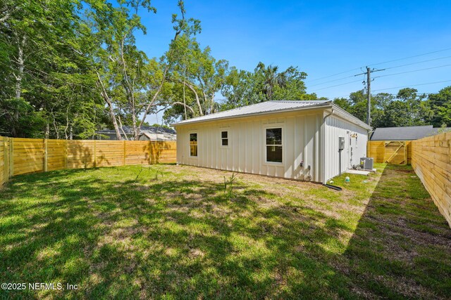 771 W 4th St, Saint Augustine, FL 32084 - rear view of house with board and batten siding and central AC