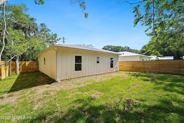 771 W 4th St, Saint Augustine, FL 32084 - rear view of property with board and batten siding and metal roof