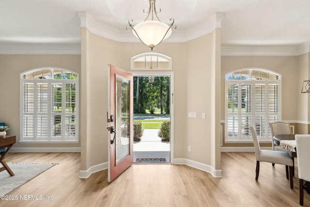 86569 N Hampton Club Way, Fernandina Beach, FL 32034 - foyer with ornamental molding, plenty of natural light, and light wood finished floors