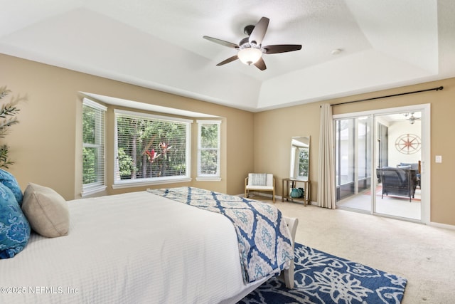 86569 N Hampton Club Way, Fernandina Beach, FL 32034 - bedroom featuring access to outside, a tray ceiling, carpet, and ceiling fan