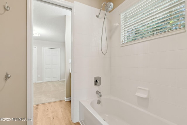 86569 N Hampton Club Way, Fernandina Beach, FL 32034 - bathroom featuring  shower combination and wood finished floors