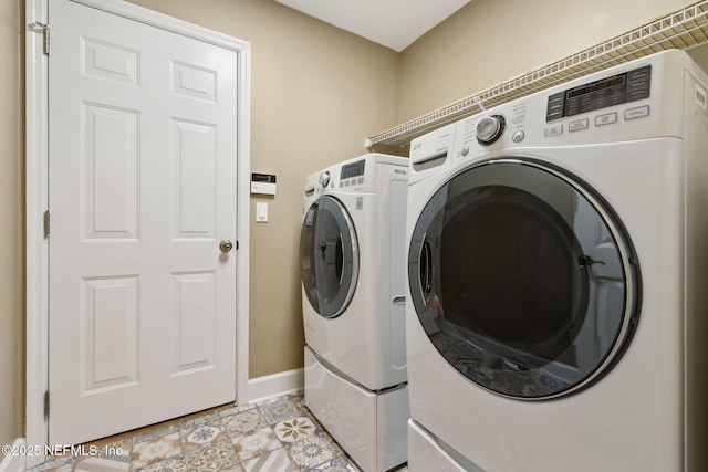 86569 N Hampton Club Way, Fernandina Beach, FL 32034 - washroom featuring washing machine and dryer and baseboards