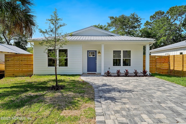 763 W 4th St, Saint Augustine, FL 32084 - view of front of home with metal roof