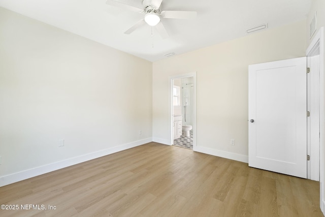 763 W 4th St, Saint Augustine, FL 32084 - unfurnished bedroom featuring light wood-type flooring, baseboards, connected bathroom, and ceiling fan