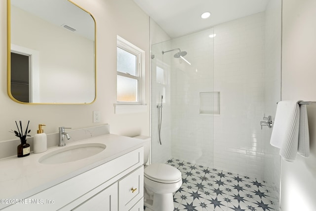 763 W 4th St, Saint Augustine, FL 32084 - bathroom featuring toilet, vanity, a tile shower, and recessed lighting