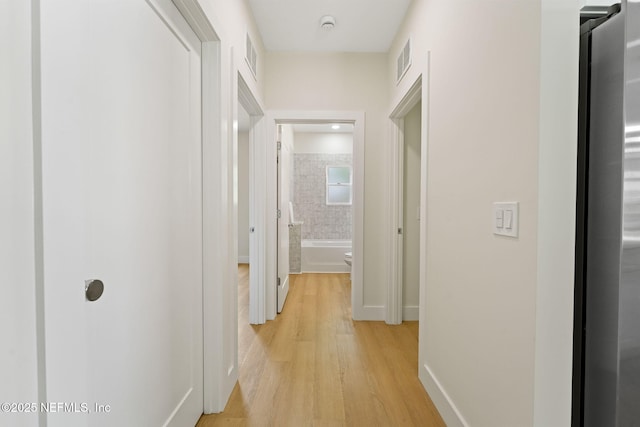 763 W 4th St, Saint Augustine, FL 32084 - corridor with light wood-style floors and baseboards