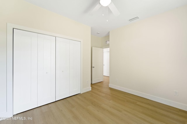 763 W 4th St, Saint Augustine, FL 32084 - unfurnished bedroom with light wood finished floors, a closet, baseboards, and ceiling fan