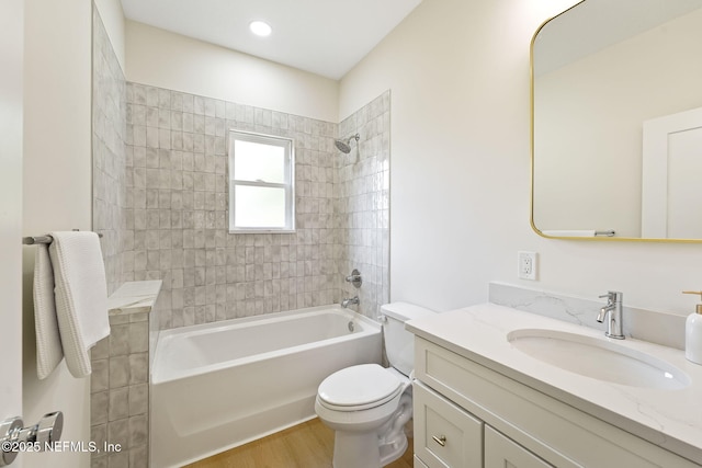 763 W 4th St, Saint Augustine, FL 32084 - full bathroom with vanity, toilet, shower / bath combination, and wood finished floors
