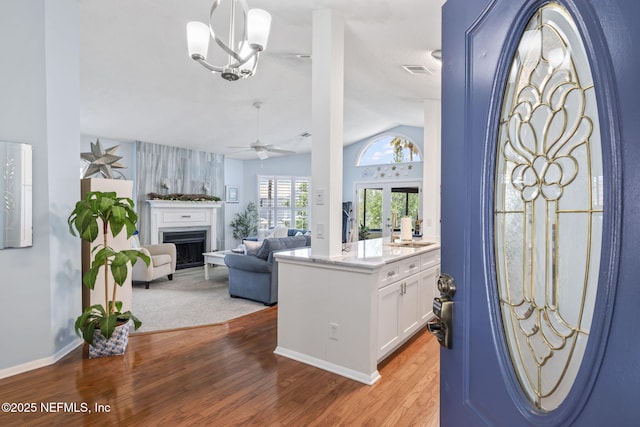 118 Governor St Unit 208, Green Cove Springs, FL 32043 - entrance foyer with vaulted ceiling, ceiling fan, light wood-style flooring, and a fireplace