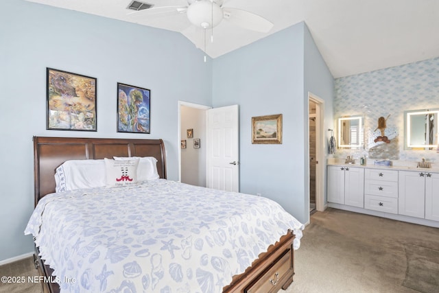 118 Governor St Unit 208, Green Cove Springs, FL 32043 - carpeted bedroom with vaulted ceiling, wallpapered walls, baseboards, a sink, and ensuite bathroom