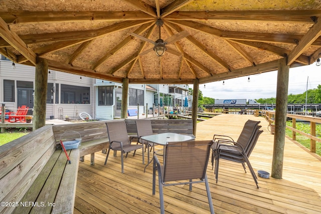 118 Governor St Unit 208, Green Cove Springs, FL 32043 - wooden deck featuring a gazebo, a sunroom, and outdoor dining area