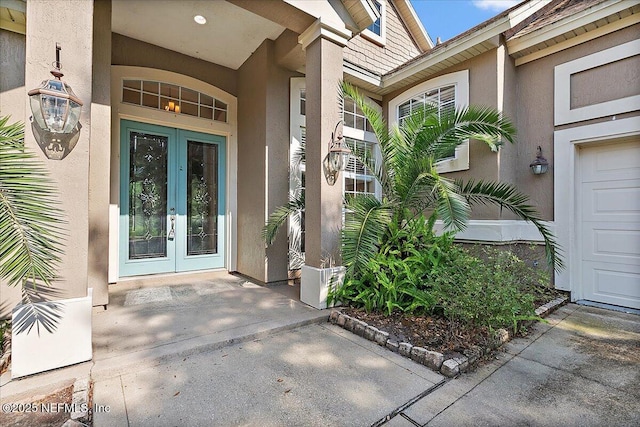 2347 W Clovelly Ln, Saint Augustine, FL 32092 - view of exterior entry featuring french doors and stucco siding
