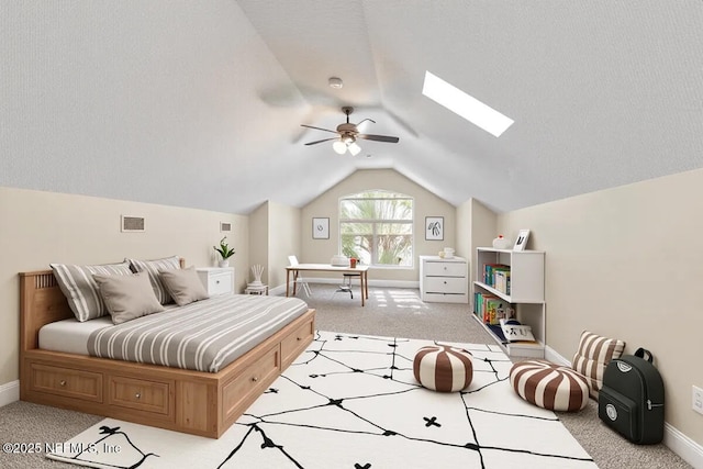 2347 W Clovelly Ln, Saint Augustine, FL 32092 - bedroom with light colored carpet, lofted ceiling, a skylight, and baseboards