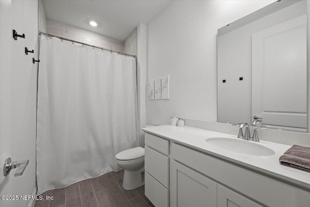 50 Dollar Ct, Saint Augustine, FL 32092 - full bathroom featuring vanity, toilet, wood finished floors, and a shower with shower curtain