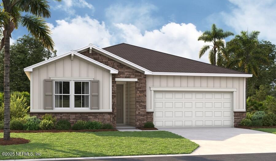 116 Arbor Alcove Ln, Saint Augustine, FL 32084 - view of front of property with board and batten siding, driveway, a front lawn, and a garage