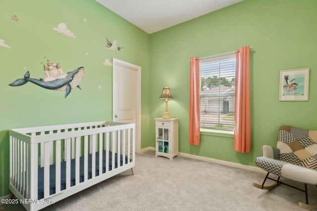 85541 Stonehurst Pkwy, Fernandina Beach, FL 32034 - bedroom with a nursery area, carpet flooring, and baseboards