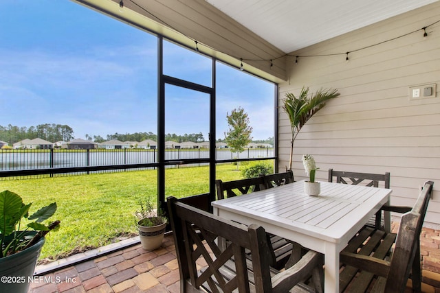 85541 Stonehurst Pkwy, Fernandina Beach, FL 32034 - sunroom / solarium featuring outdoor dining space, a water view, and a residential view
