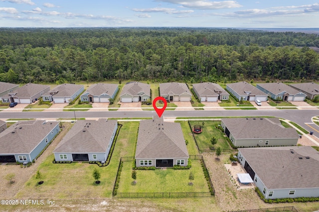 85541 Stonehurst Pkwy, Fernandina Beach, FL 32034 - aerial perspective of suburban area with a heavily wooded area