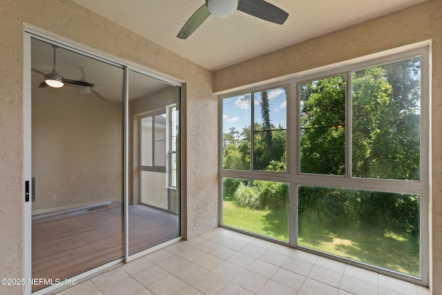 709 Augusta Cir, Saint Augustine, FL 32086 - unfurnished sunroom featuring tile patterned floors and a textured wall
