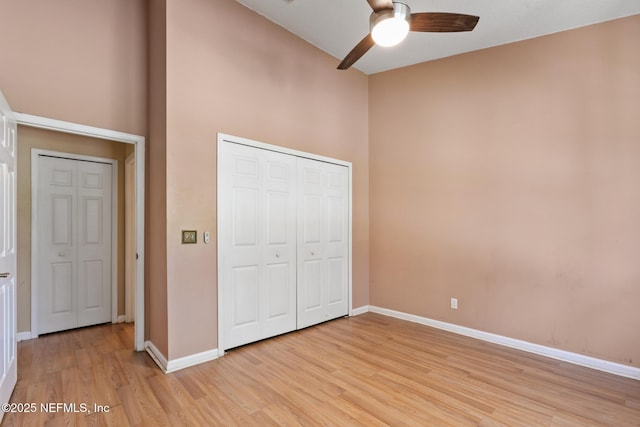 709 Augusta Cir, Saint Augustine, FL 32086 - unfurnished bedroom with light wood-type flooring, baseboards, a closet, and a ceiling fan