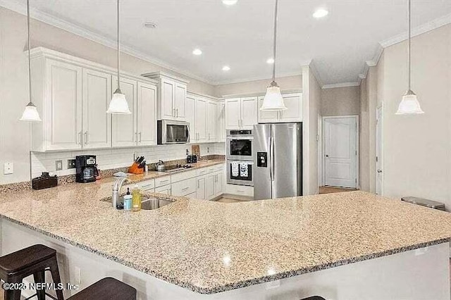 97163 Bluff View Cir, Yulee, FL 32097 - kitchen with stainless steel appliances, a peninsula, a breakfast bar, backsplash, and light stone counters