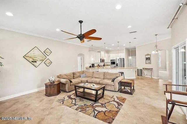 97163 Bluff View Cir, Yulee, FL 32097 - living room with recessed lighting, a ceiling fan, ornamental molding, and arched walkways