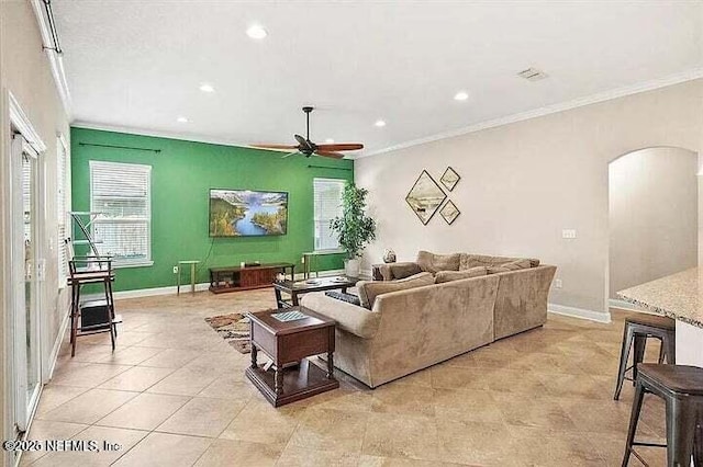 97163 Bluff View Cir, Yulee, FL 32097 - living room with arched walkways, ornamental molding, ceiling fan, healthy amount of natural light, and recessed lighting