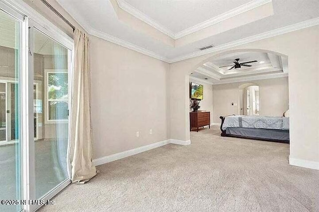 97163 Bluff View Cir, Yulee, FL 32097 - bedroom with a raised ceiling, arched walkways, carpet, and crown molding