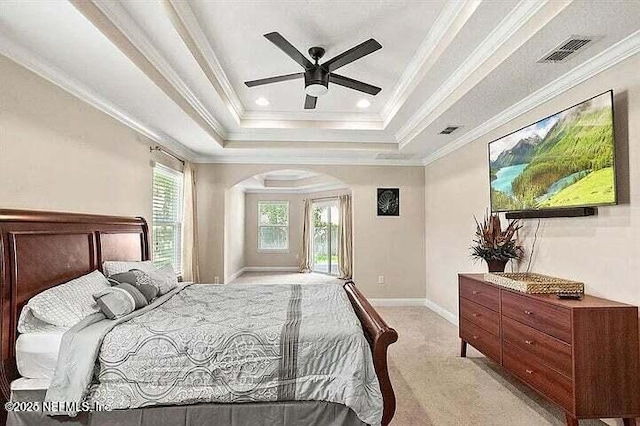 97163 Bluff View Cir, Yulee, FL 32097 - bedroom with a tray ceiling, light colored carpet, arched walkways, access to exterior, and ornamental molding