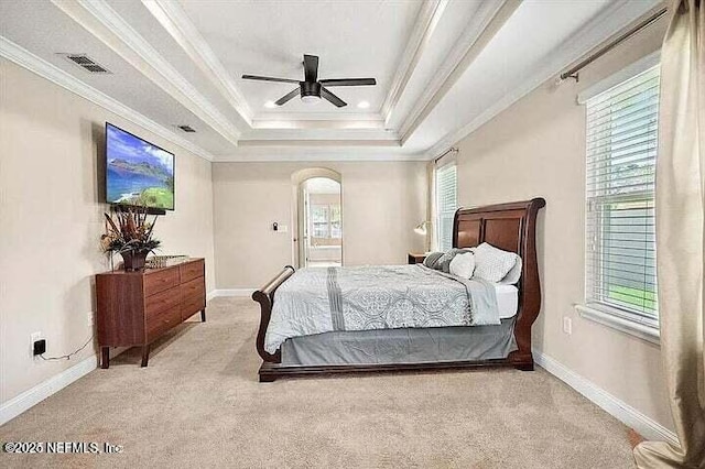 97163 Bluff View Cir, Yulee, FL 32097 - bedroom featuring carpet flooring, crown molding, arched walkways, a tray ceiling, and a ceiling fan