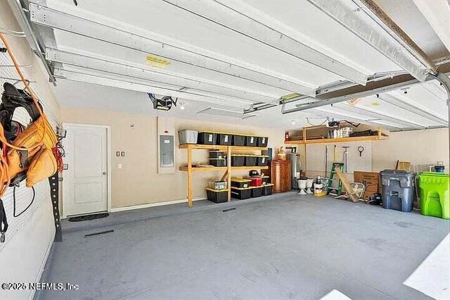 97163 Bluff View Cir, Yulee, FL 32097 - garage featuring electric panel and a garage door opener