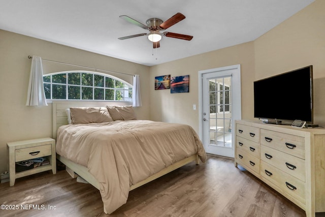 1655 The Greens Way Unit 3416, Jacksonville Beach, FL 32250 - bedroom featuring access to outside, wood finished floors, and a ceiling fan