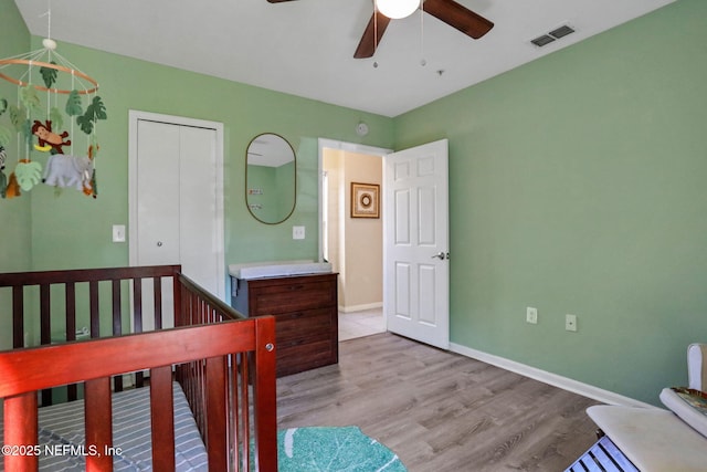 1655 The Greens Way Unit 3416, Jacksonville Beach, FL 32250 - bedroom with wood finished floors, baseboards, and ceiling fan