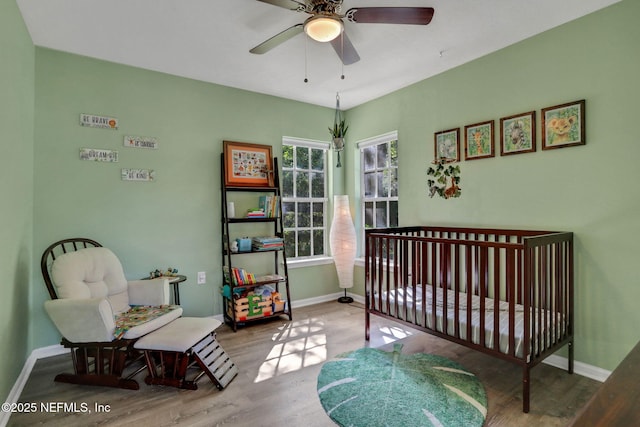 1655 The Greens Way Unit 3416, Jacksonville Beach, FL 32250 - bedroom featuring wood finished floors, baseboards, and ceiling fan