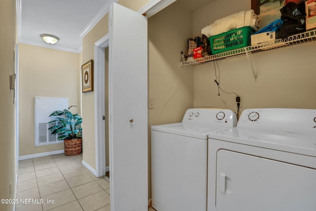 1655 The Greens Way Unit 3416, Jacksonville Beach, FL 32250 - washroom with ornamental molding, independent washer and dryer, light tile patterned floors, and baseboards