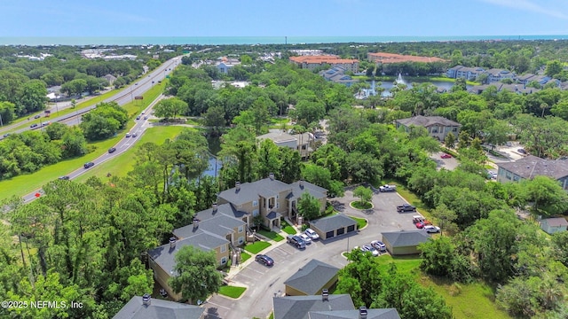 1655 The Greens Way Unit 3416, Jacksonville Beach, FL 32250 - aerial view of residential area with a tree filled landscape and a large body of water