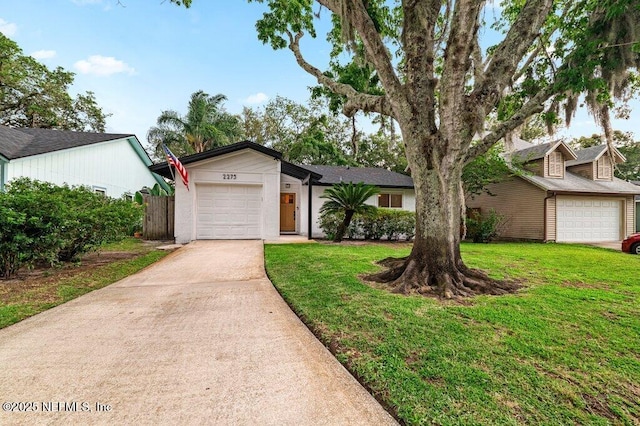 2275 Fairway Villas Ln N, Atlantic Beach, FL 32233 - view of front of home with driveway and a garage