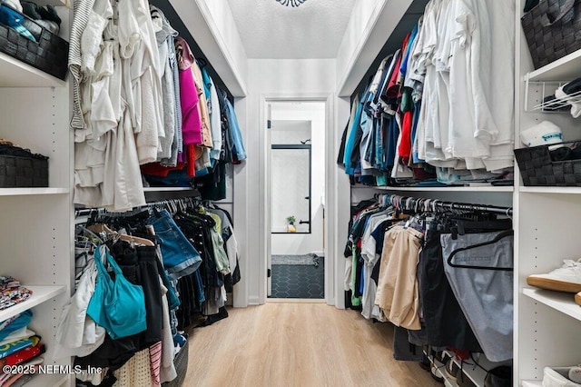 2275 Fairway Villas Ln N, Atlantic Beach, FL 32233 - walk in closet with wood finished floors