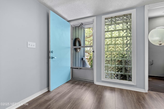2279 Seminole Rd Unit 11, Atlantic Beach, FL 32233 - entryway featuring wood finished floors, a textured ceiling, and baseboards