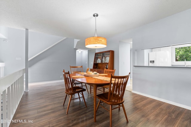 2279 Seminole Rd Unit 11, Atlantic Beach, FL 32233 - dining area with wood finished floors and baseboards
