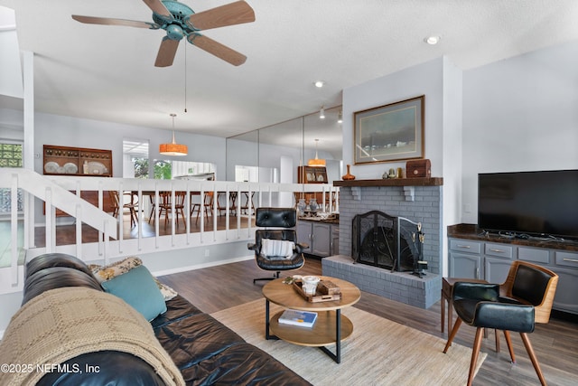 2279 Seminole Rd Unit 11, Atlantic Beach, FL 32233 - living room with wood finished floors, ceiling fan, plenty of natural light, and a brick fireplace
